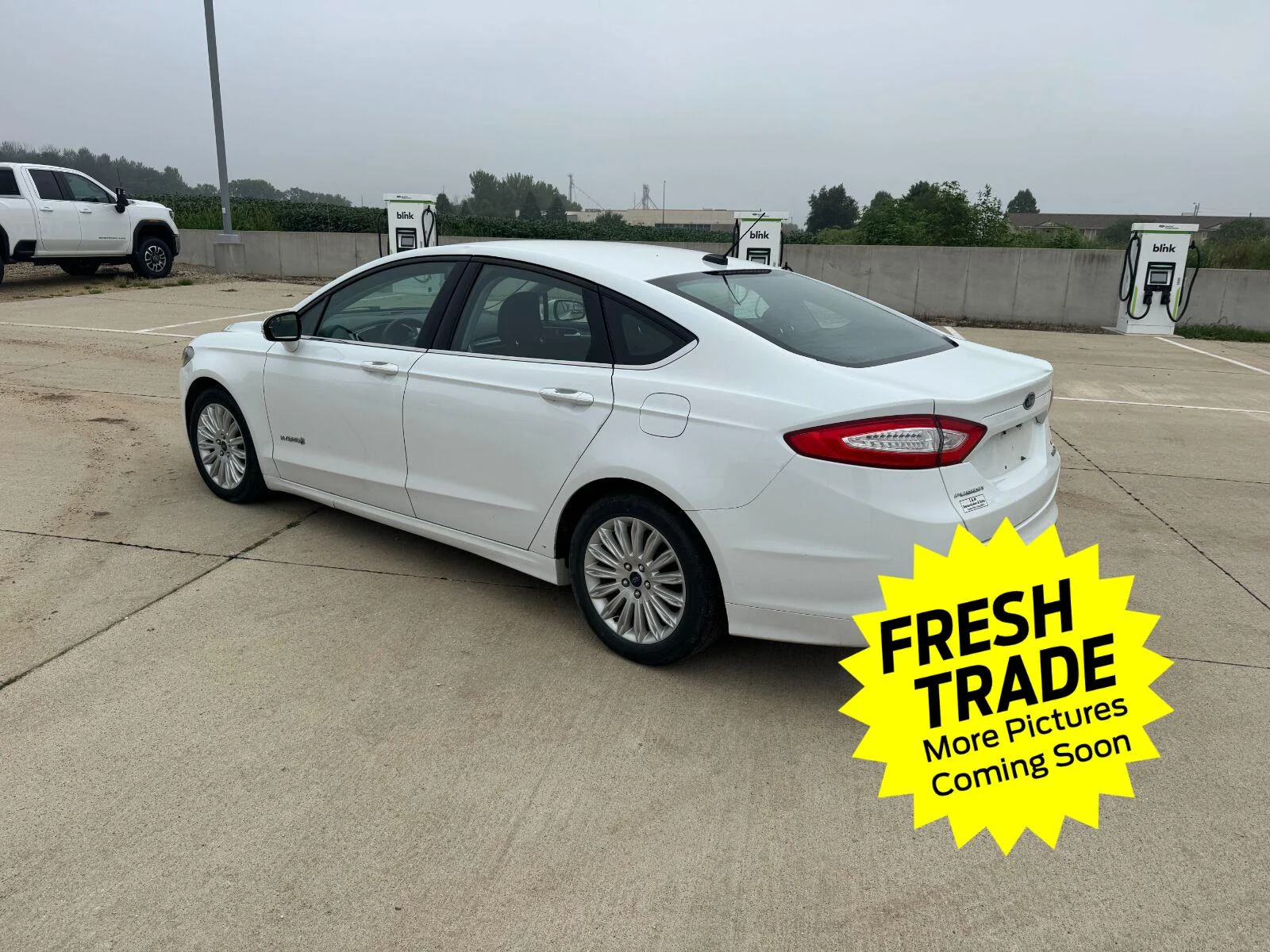 Used 2014 Ford Fusion SE Hybrid with VIN 3FA6P0LU8ER271941 for sale in Charles City, IA