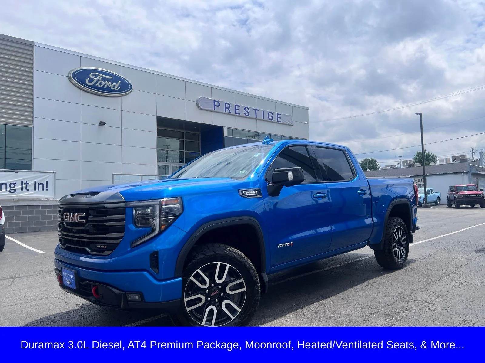 Used 2024 Blue Metallic GMC AT4 image 1