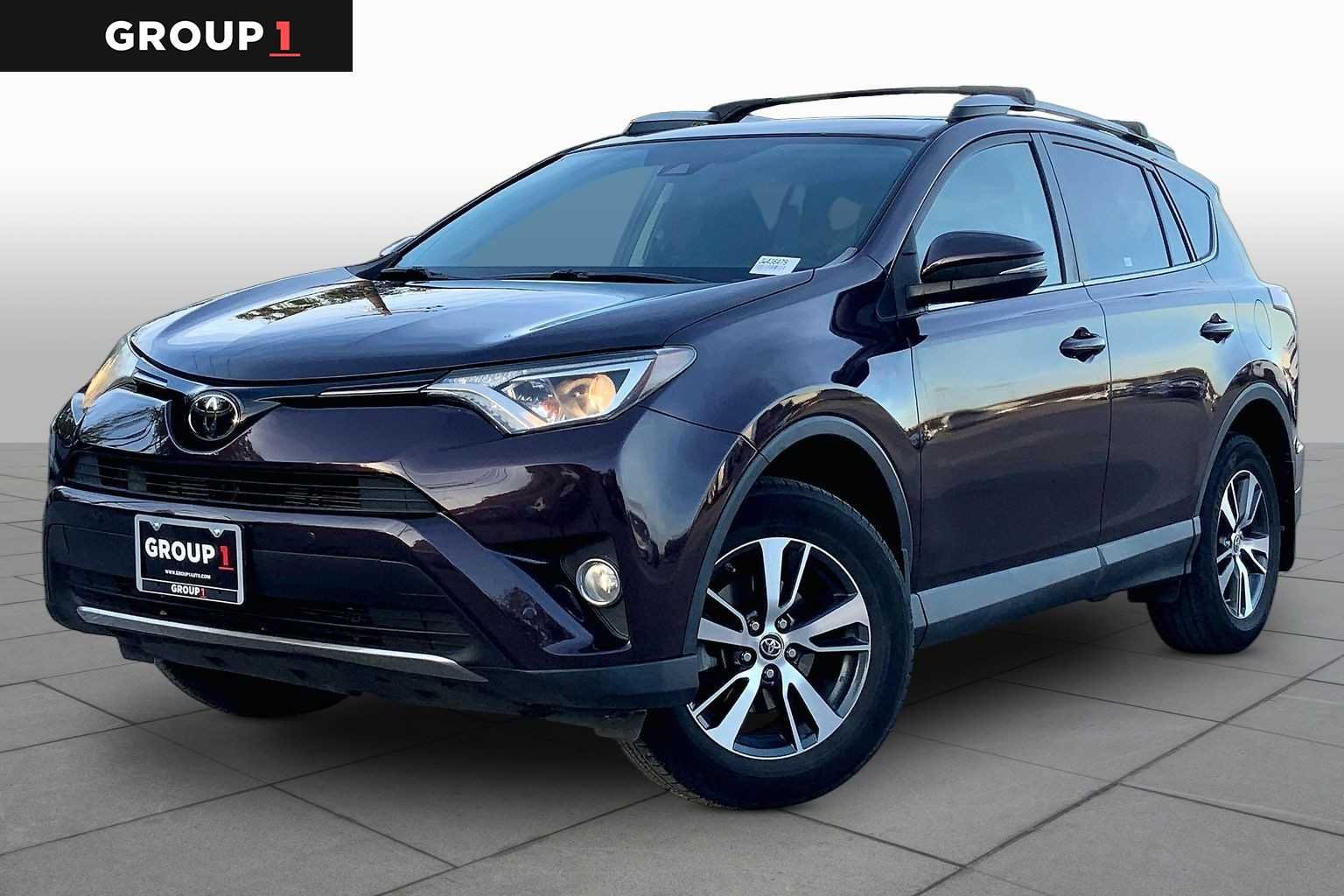 Used 2018 Black Currant Metallic Toyota XLE image 1