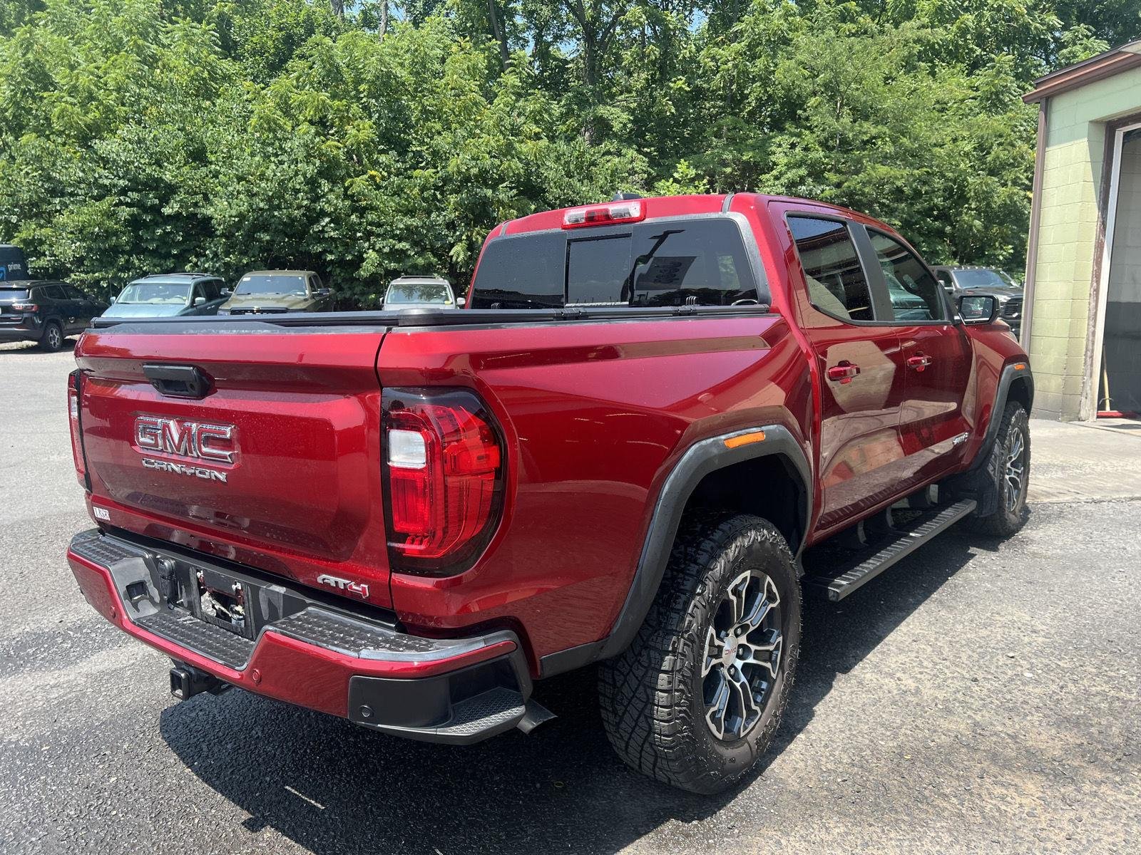Used 2024 Volcanic Red Tintcoat GMC 4WD AT4 image 3