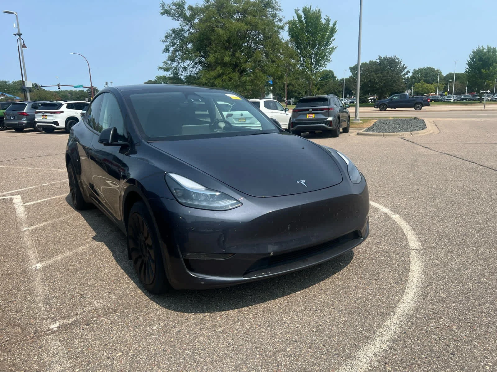 Used 2024 Tesla Model Y Long Range with VIN 7SAYGDEE9RA233867 for sale in Minneapolis, MN
