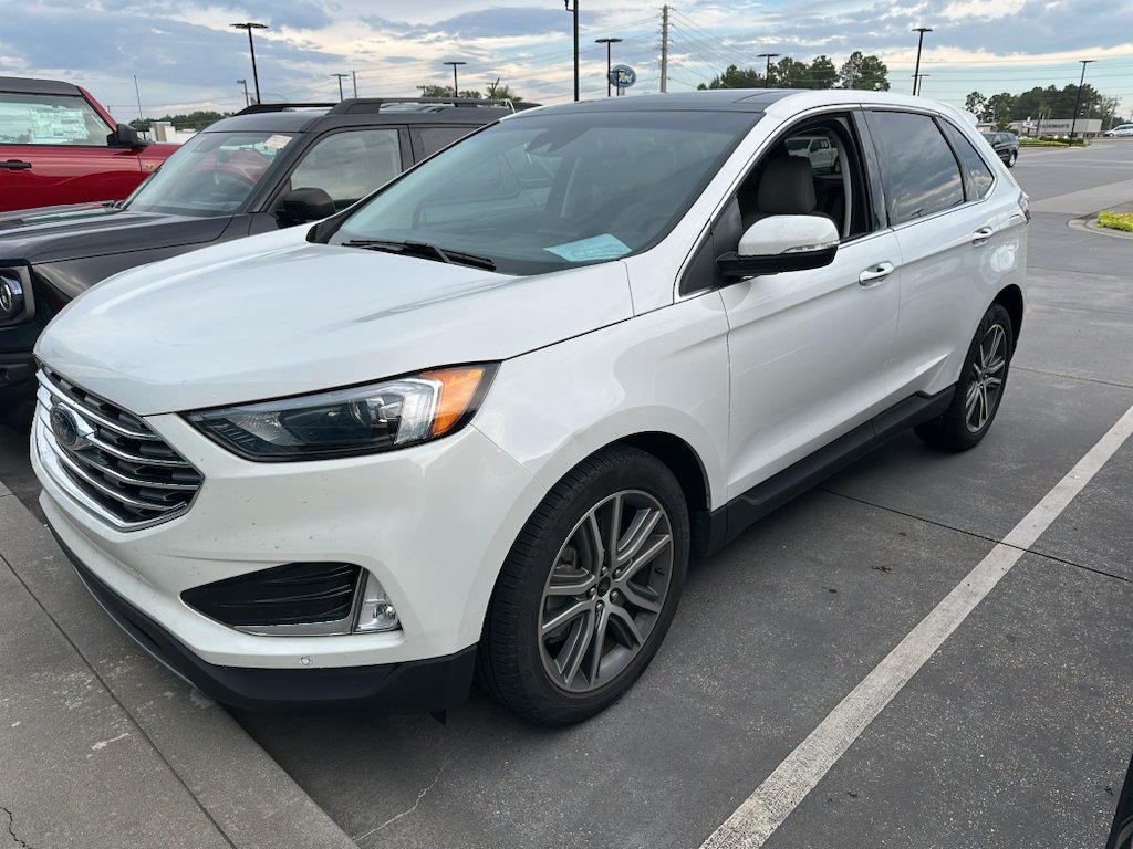 Used 2023 Star White Metallic Tri-Coat Ford Titanium image 1