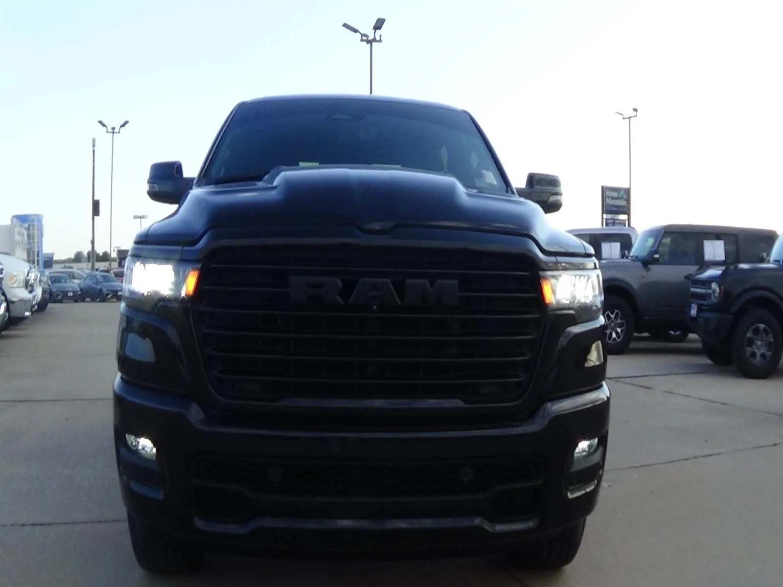 Used 2025 Diamond Black Crystal Pearl Coat (pxj) RAM Laramie image 3