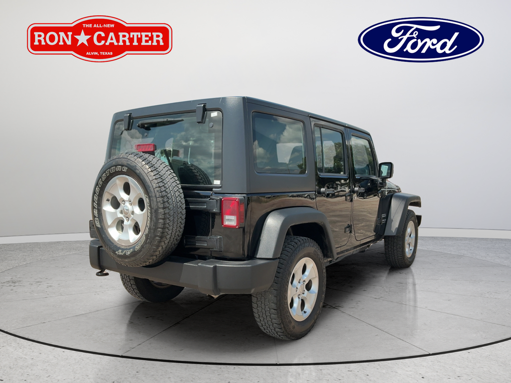 Used 2013 Black Jeep Unlimited Sport image 6
