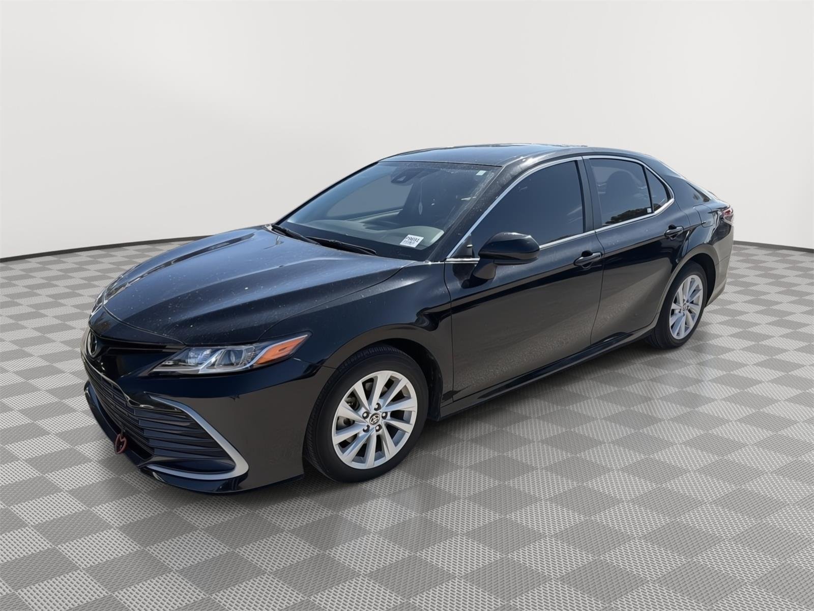 Used 2024 Midnight Black Metallic Toyota LE image 1