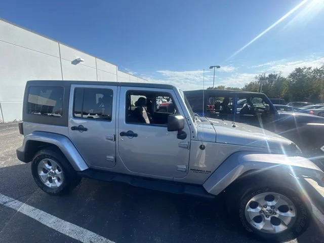 Used 2013 Silver Jeep Unlimited Sahara image 1