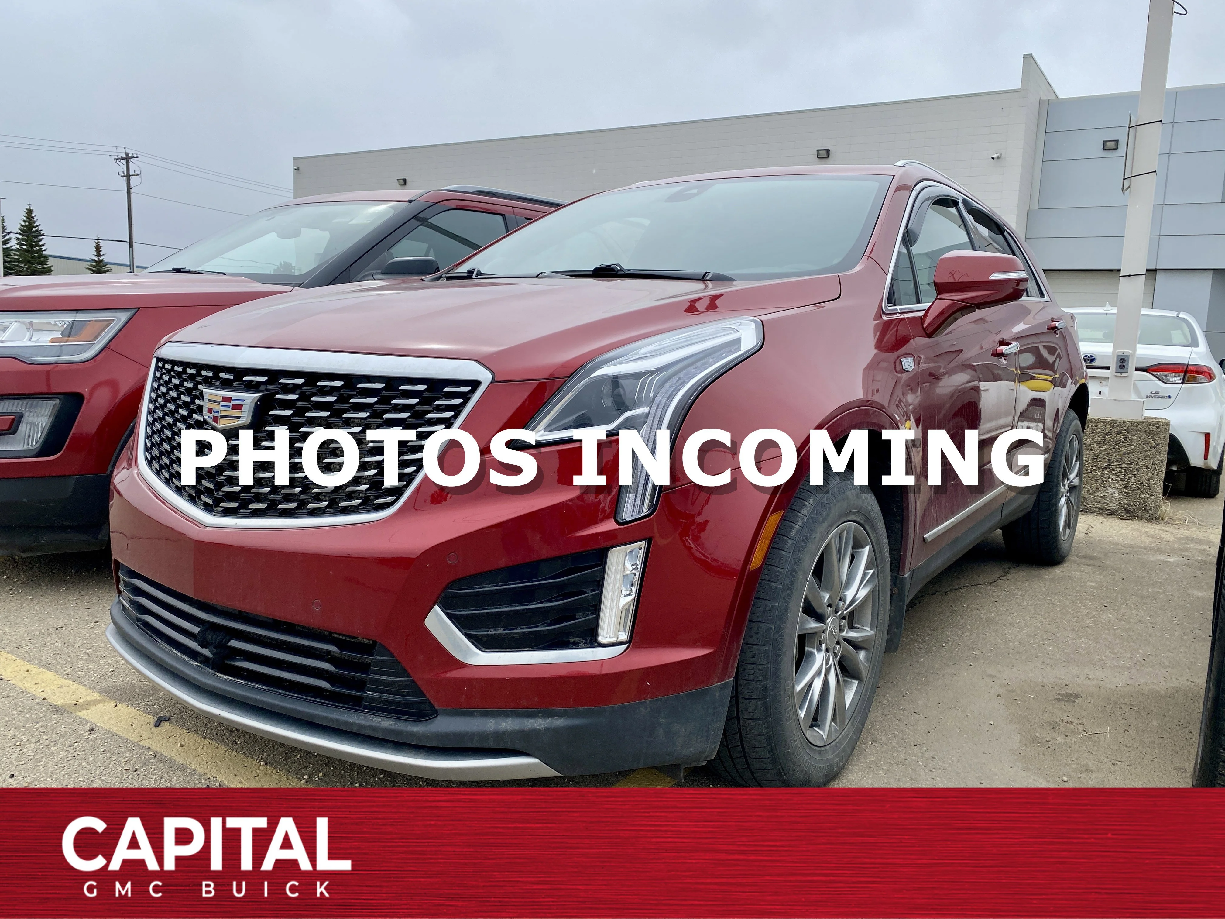 Used 2021 Red Cadillac AWD Premium Luxury image 1