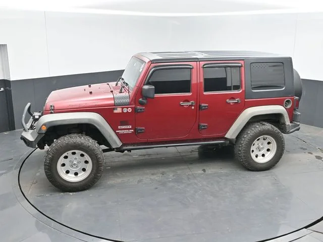 Used 2012 Red Jeep Unlimited Sport image 18