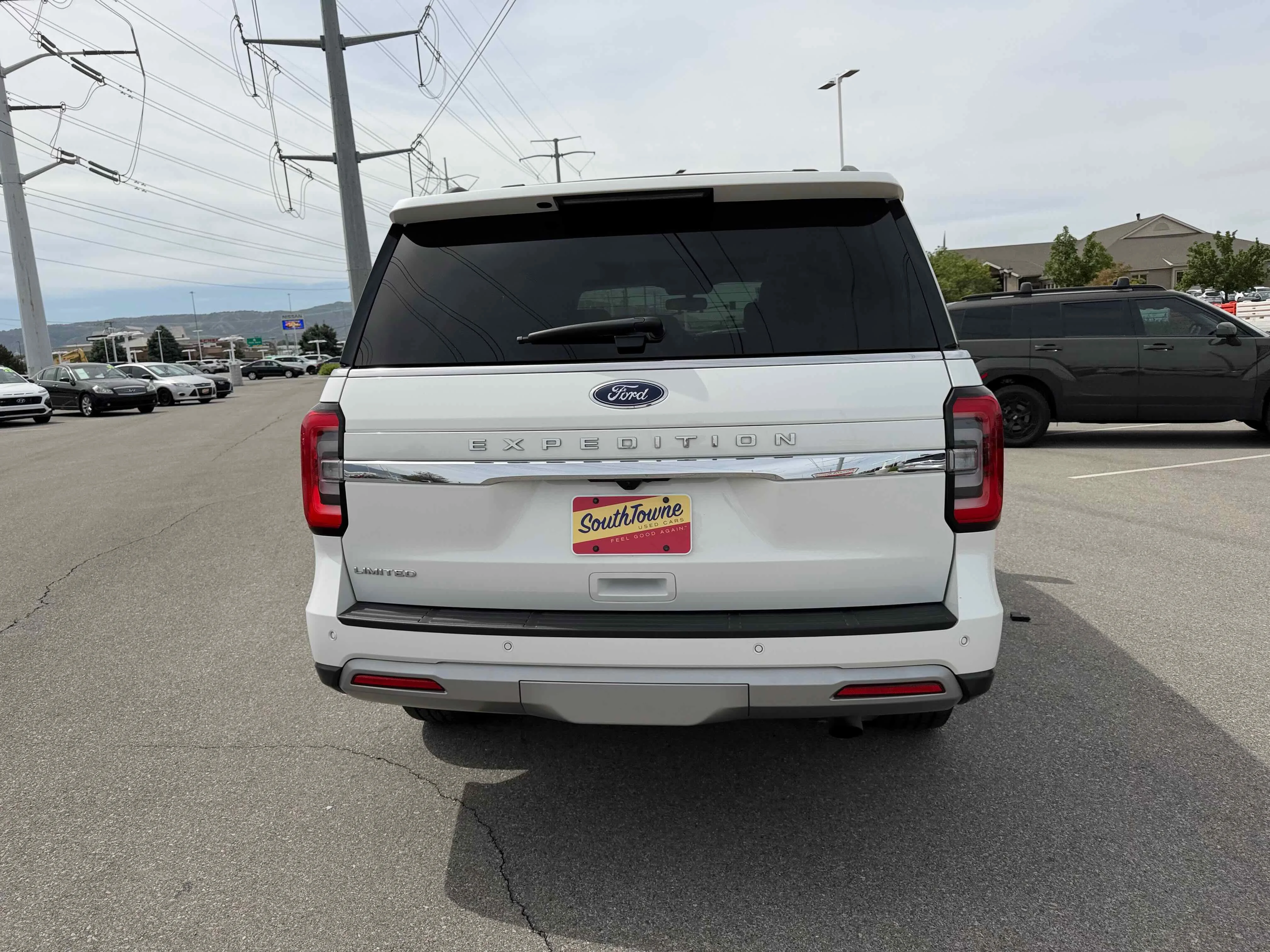 Used 2023 White Metallic Ford Limited image 6