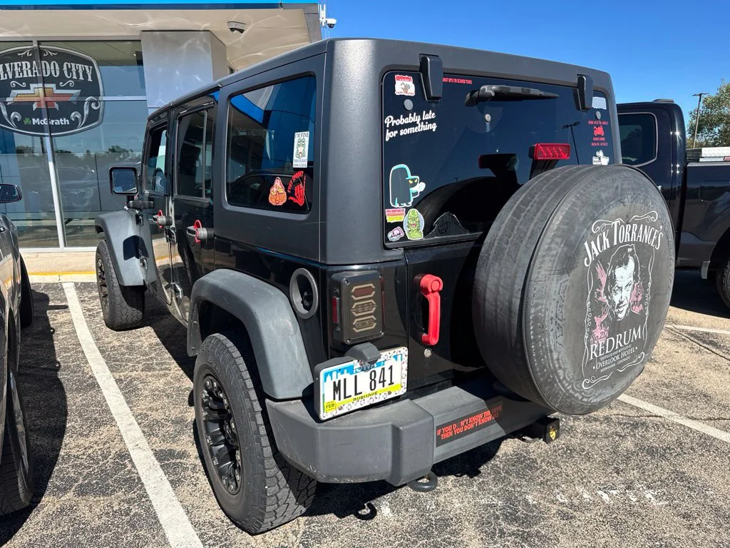Used 2013 Black Jeep Unlimited Sport image 4