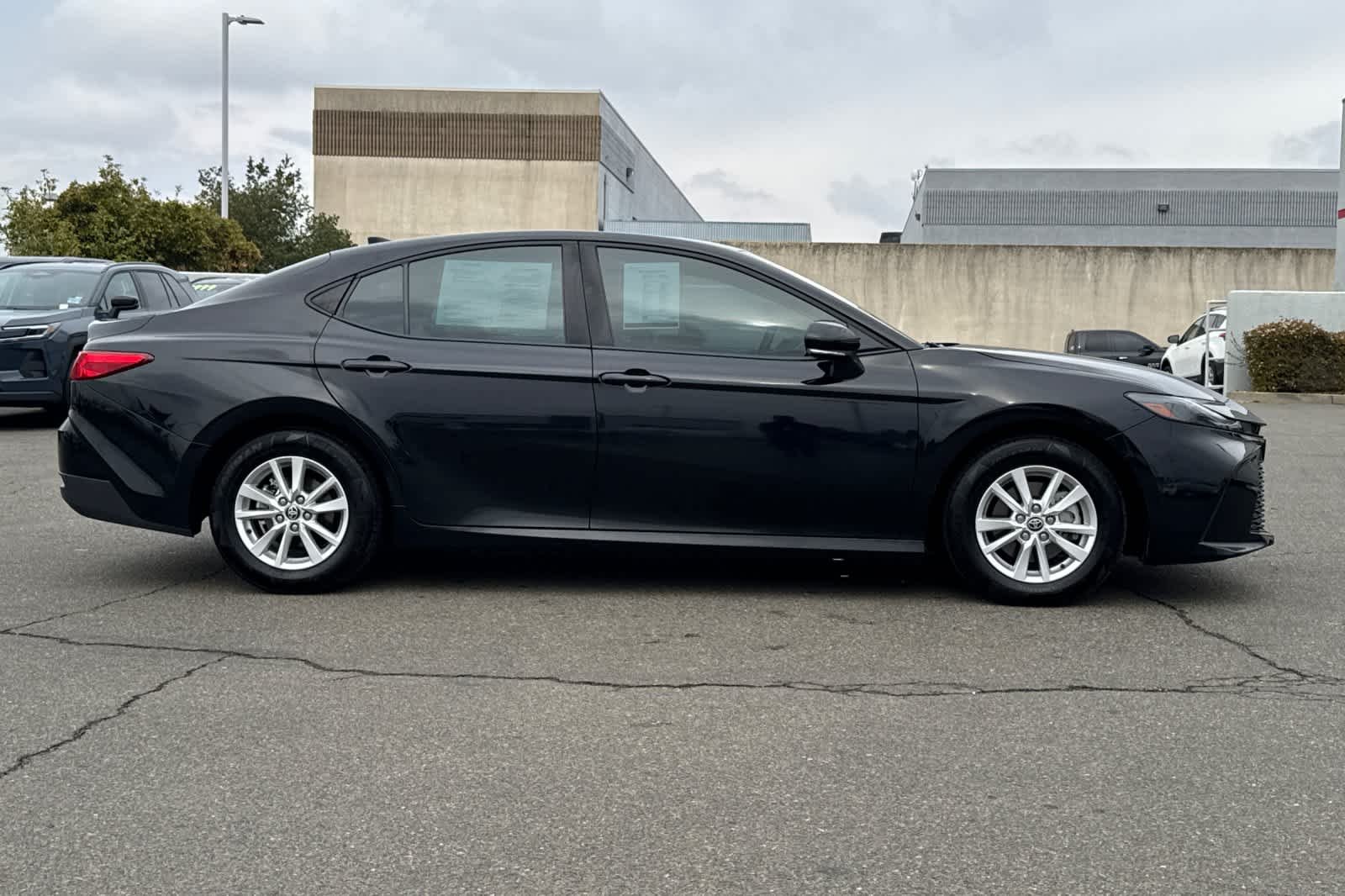Used 2025 Midnight Black Metallic Toyota LE image 6