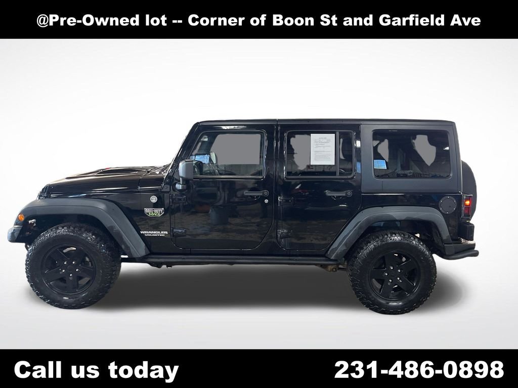 Used 2012 Black Jeep Unlimited Rubicon image 2