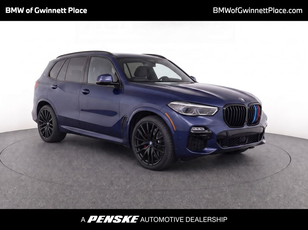 Used 2021 Tanzanite Blue II Metallic BMW M50i image 1