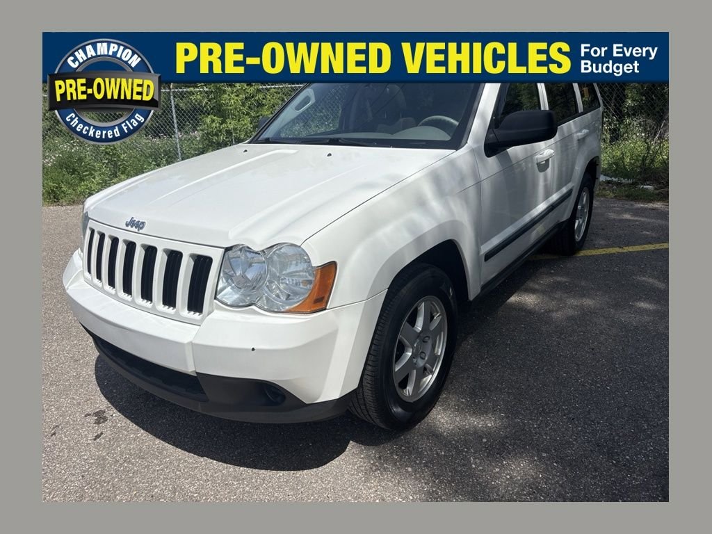 Used 2009 Stone White Jeep Laredo image 1