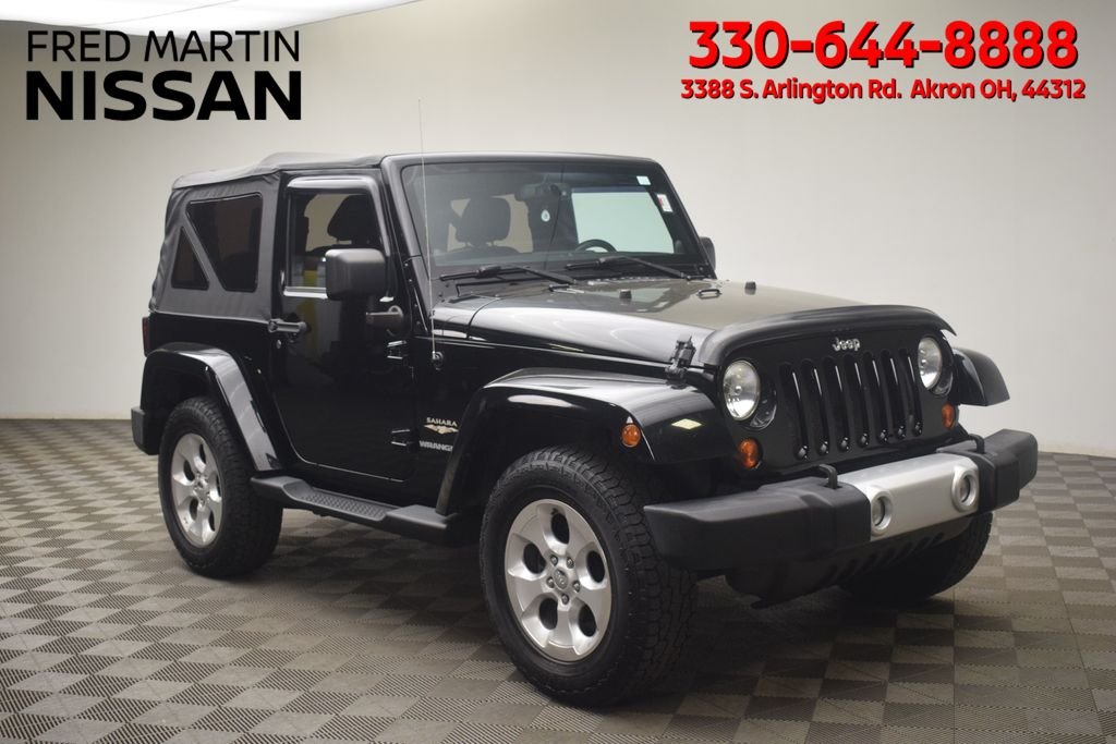 Used 2013 Black Jeep Sahara image 1