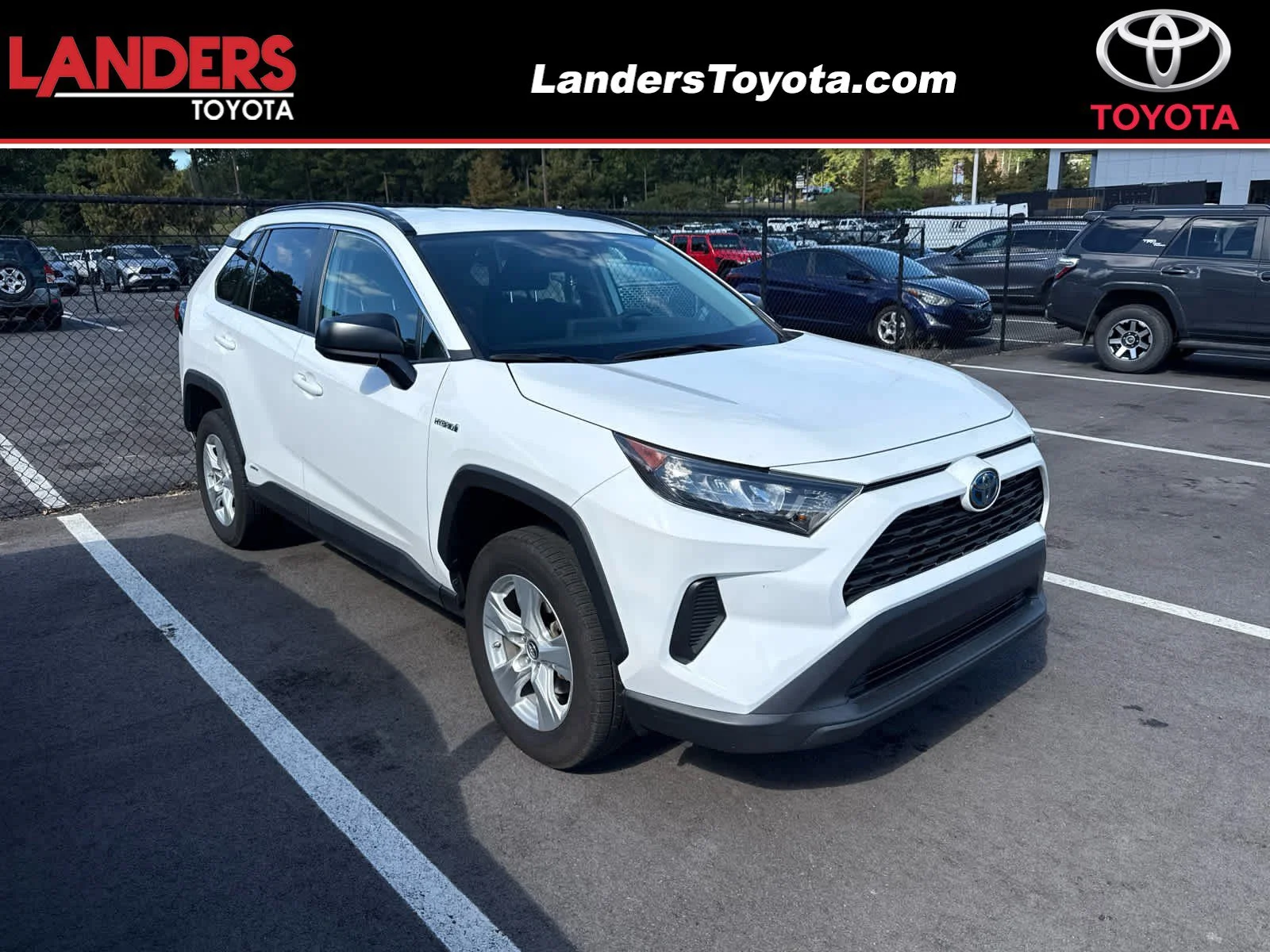 Used 2021 Super White Toyota Hybrid LE image 1