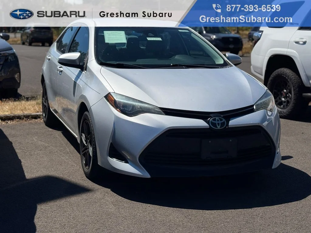 Used 2017 Classic Silver Metallic Toyota LE image 1