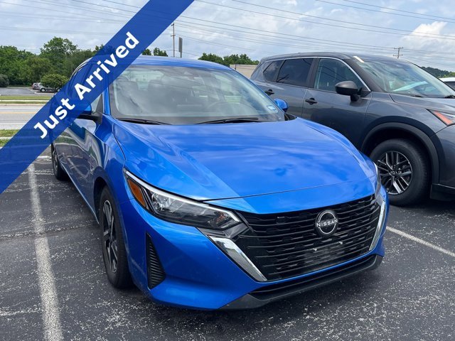 Used 2024 Electric Blue Metallic Nissan SV image 1