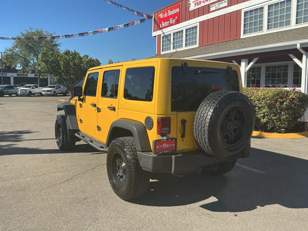 Used 2015 Baja Yellow Jeep Sport image 7