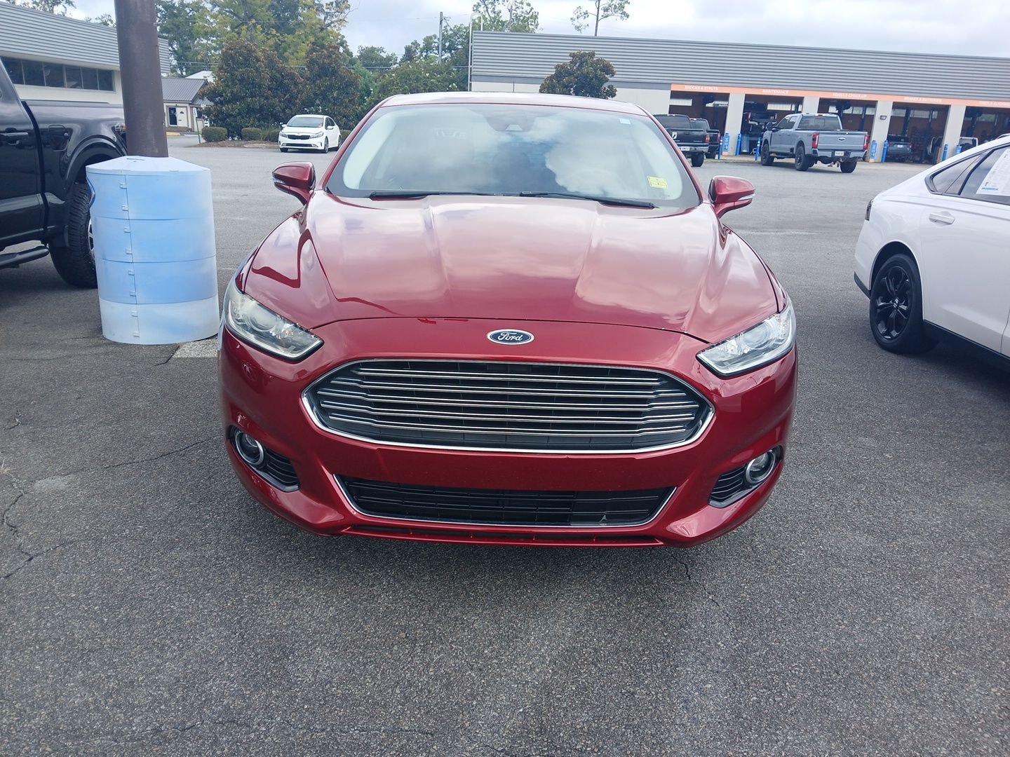 Used 2013 Ruby Red Metallic Ford Titanium image 2