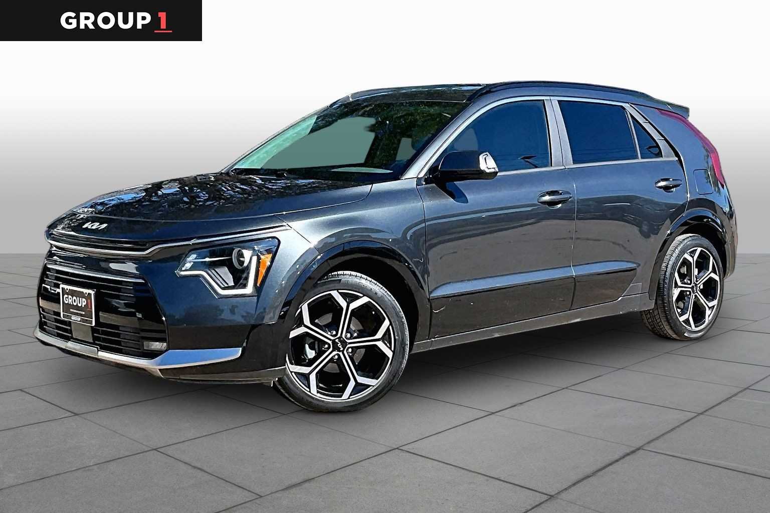 Used 2024 Graphite Gray Kia EX Touring image 1