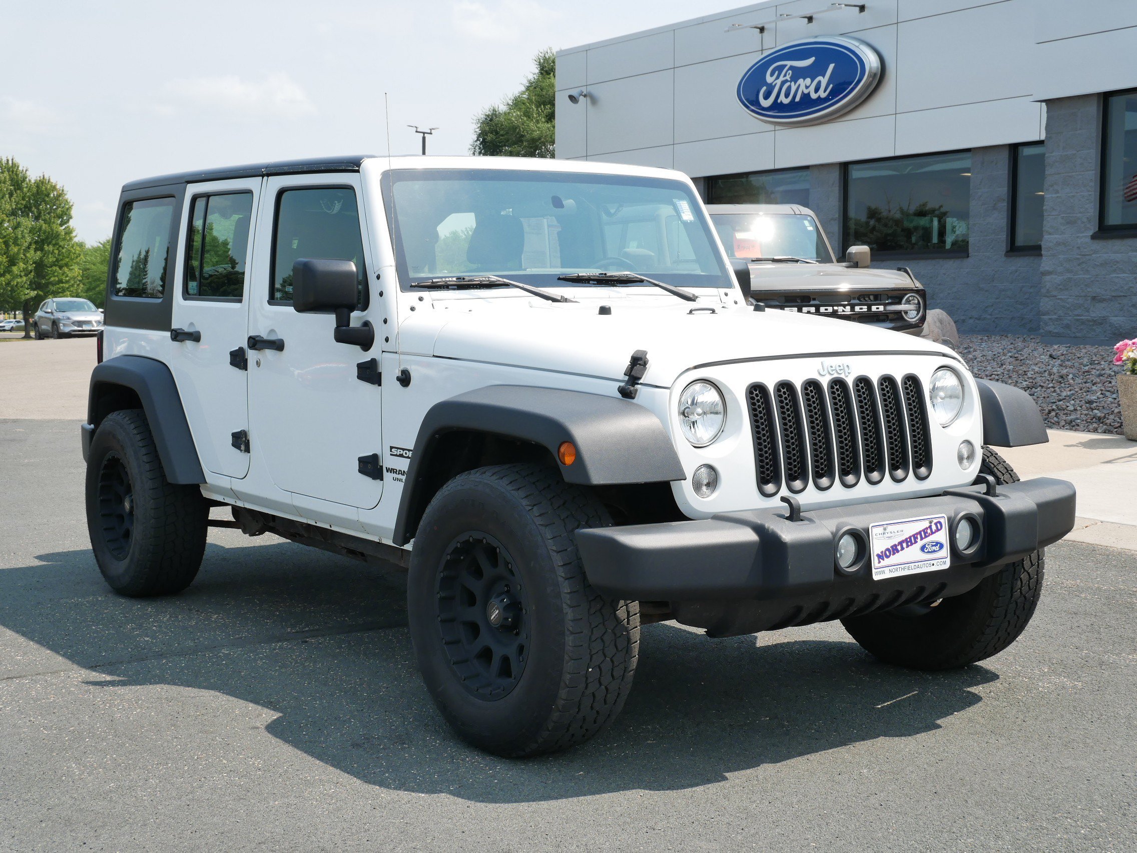 Used 2017 Jeep Wrangler Unlimited Sport with VIN 1C4BJWDG7HL521999 for sale in Northfield, Minnesota
