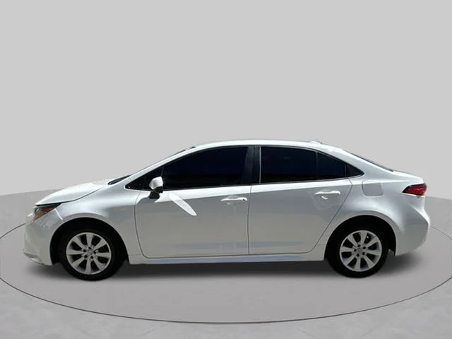 Used 2021 Super White Toyota LE image 2