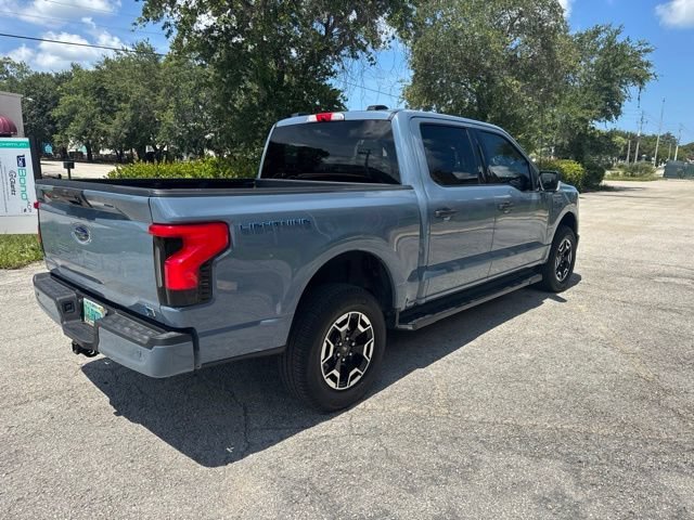 Used 2023 Ford F-150 Lightning XLT with VIN 1FTVW1EL7PWG48990 for sale in Naples, FL