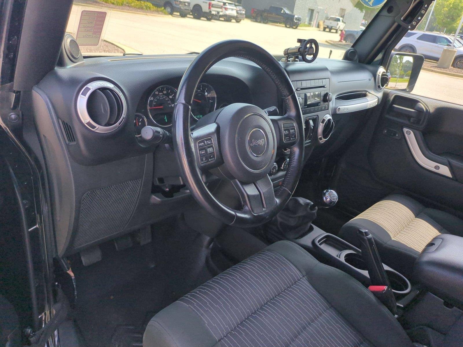 Used 2012 Black Clearcoat Jeep Sahara image 17