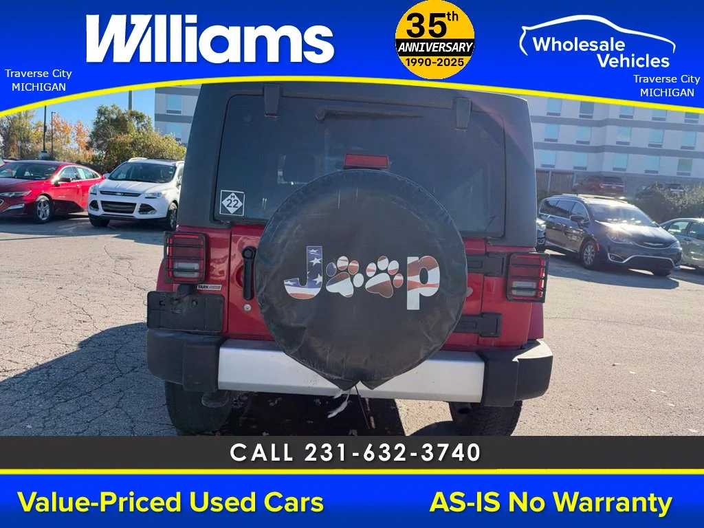 Used 2013 Flame Red Jeep Unlimited Sahara image 7