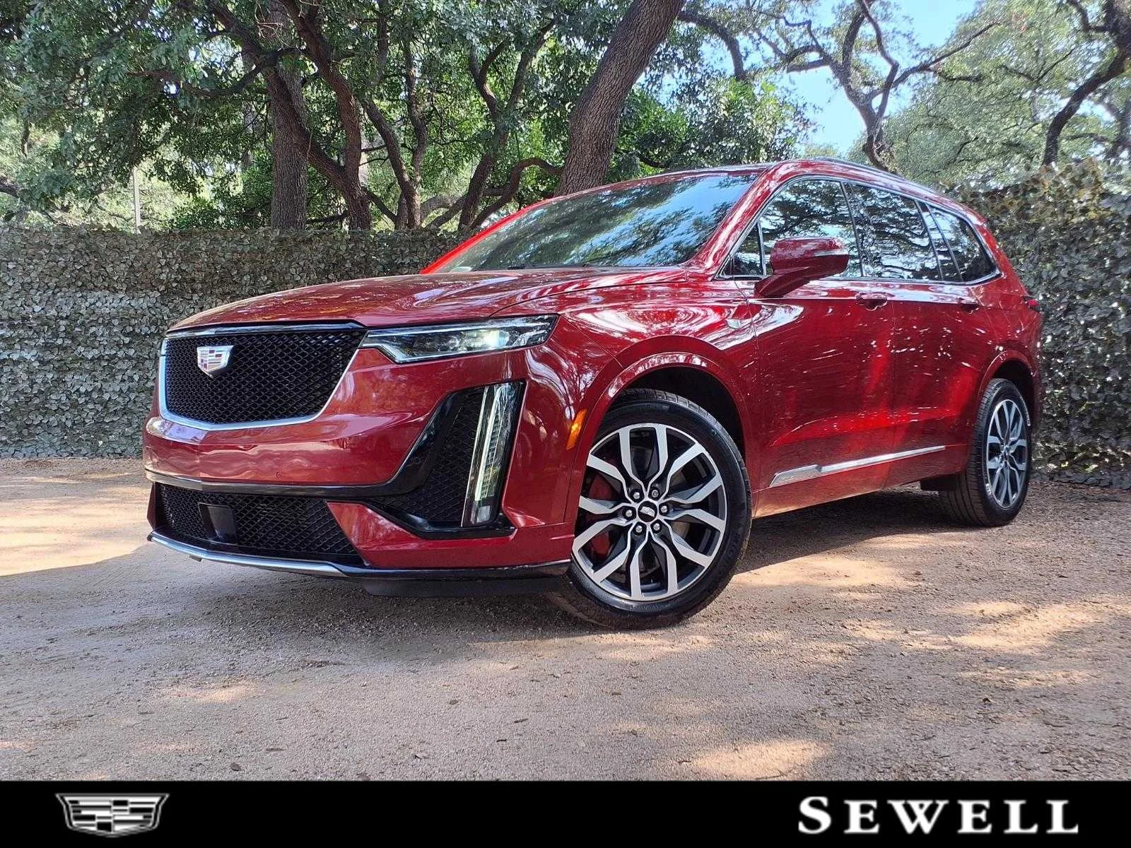 Used 2024 Radiant Red Tintcoat Cadillac Sport image 1