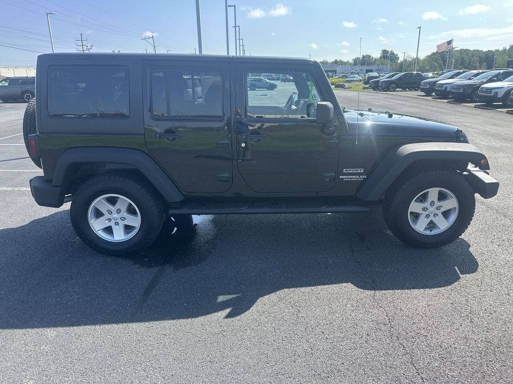 Used 2014 Black Jeep Unlimited Sport image 9