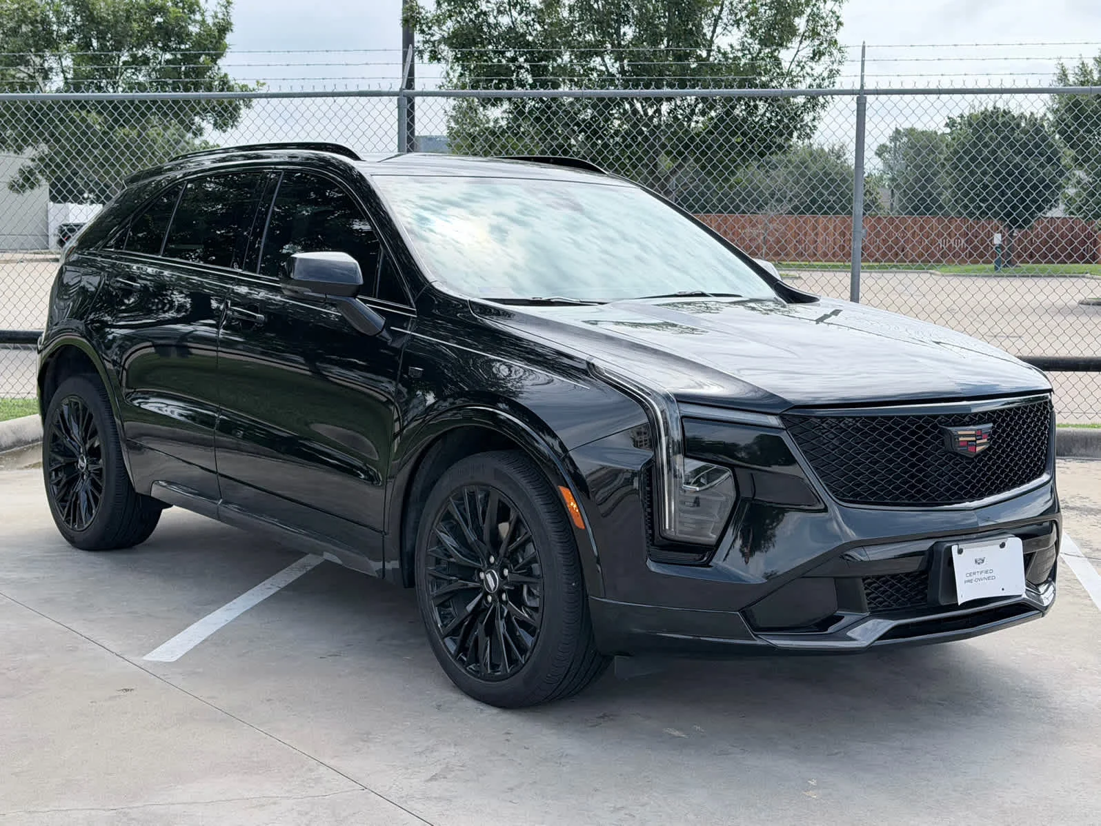 Used 2024 Stellar Black Metallic Cadillac Sport image 3