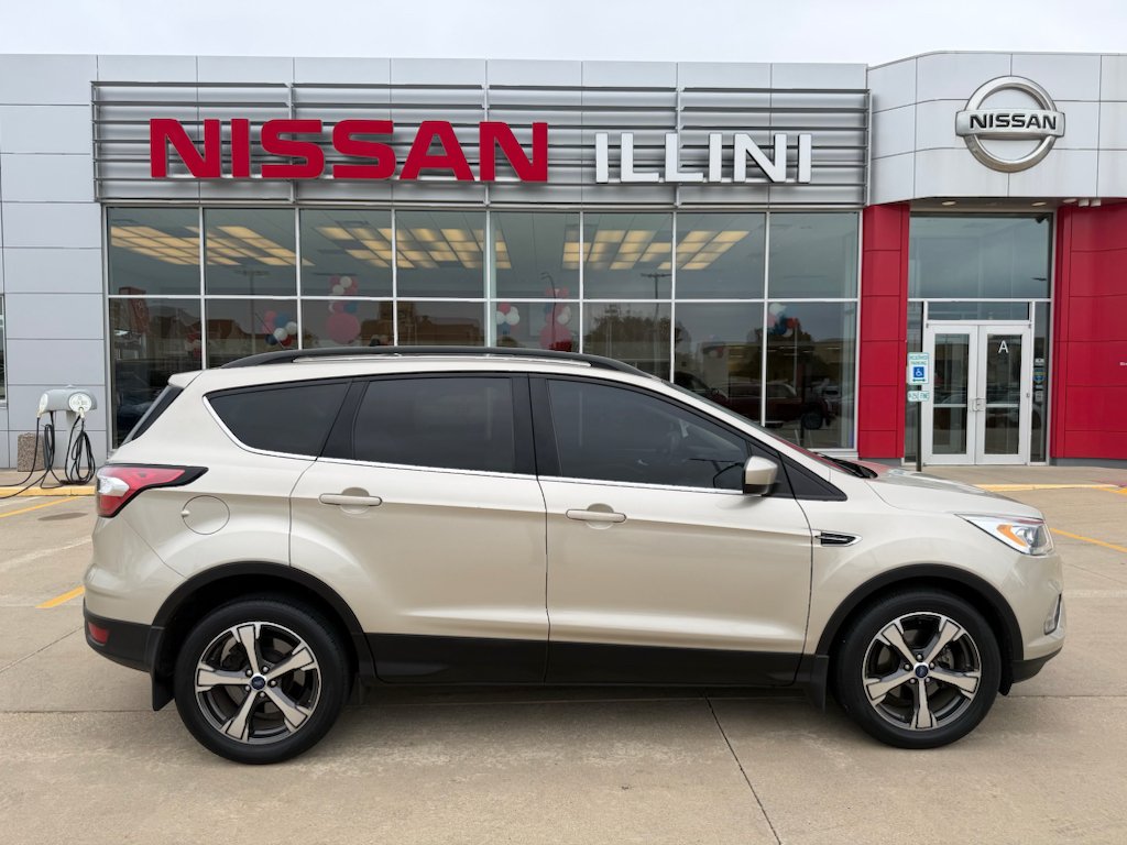 Used 2018 White Gold Metallic Ford SEL image 1