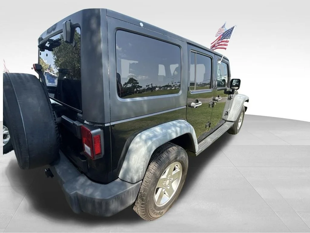 Used 2012 Black Jeep Unlimited Sport image 7