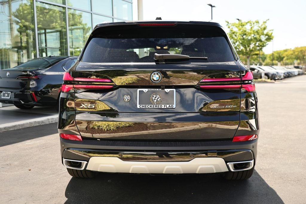 New 2026 Black Sapphire Metallic BMW xDrive50e image 10