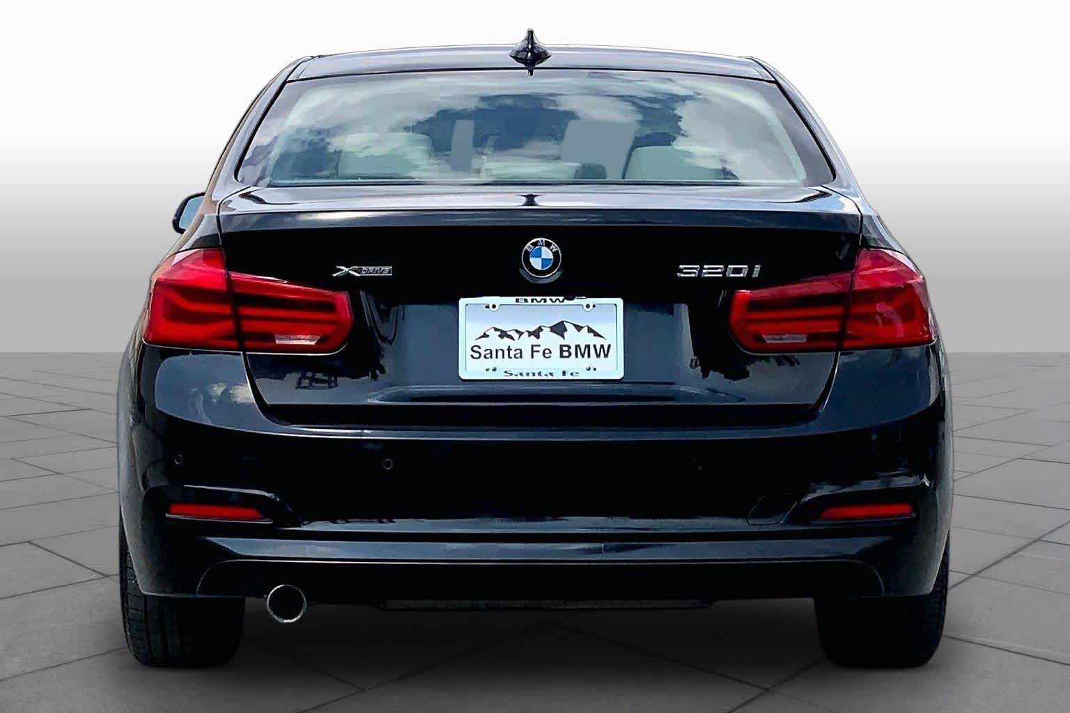 Used 2016 Black Sapphire Metallic BMW 320i xDrive image 4
