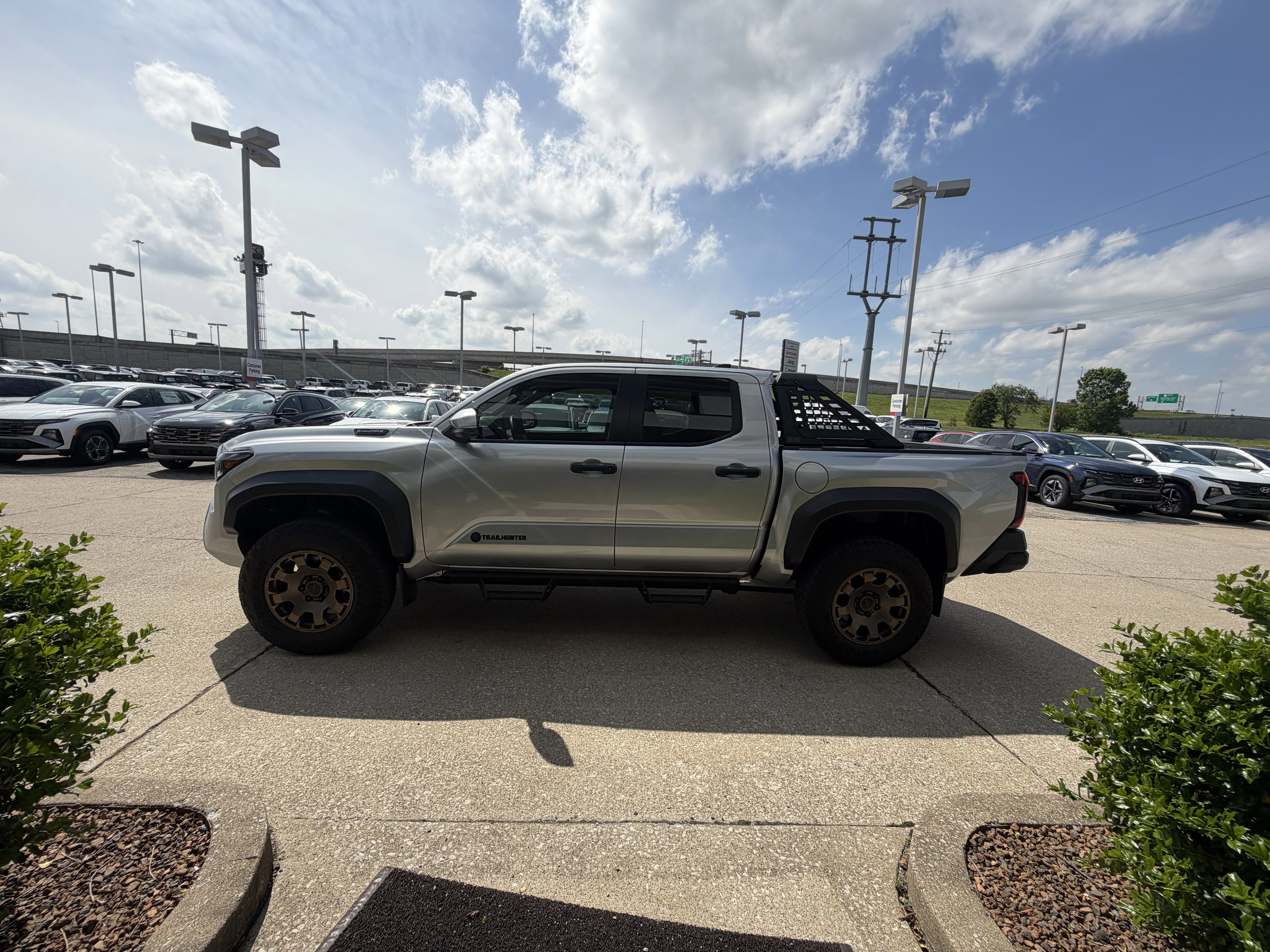 Used 2024 Celestial Silver Metallic Toyota Trailhunter Hybrid image 19