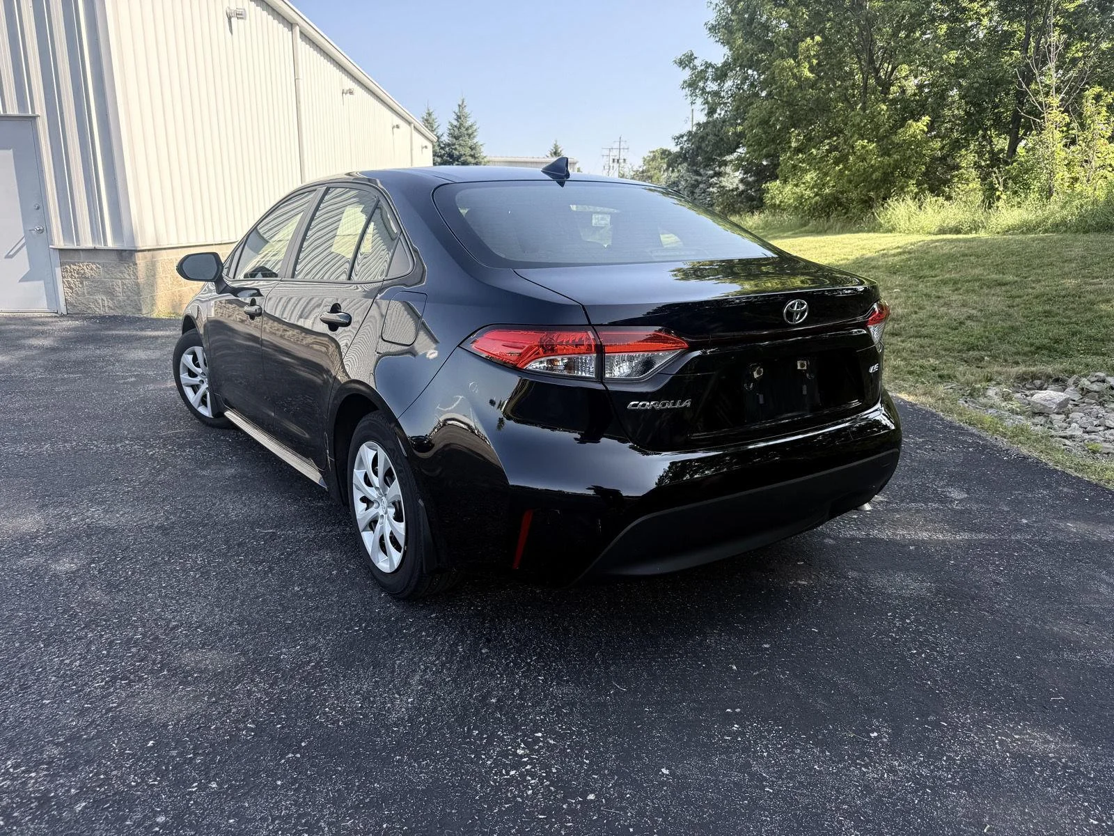 Used 2023 Midnight Black Metallic Toyota LE image 2