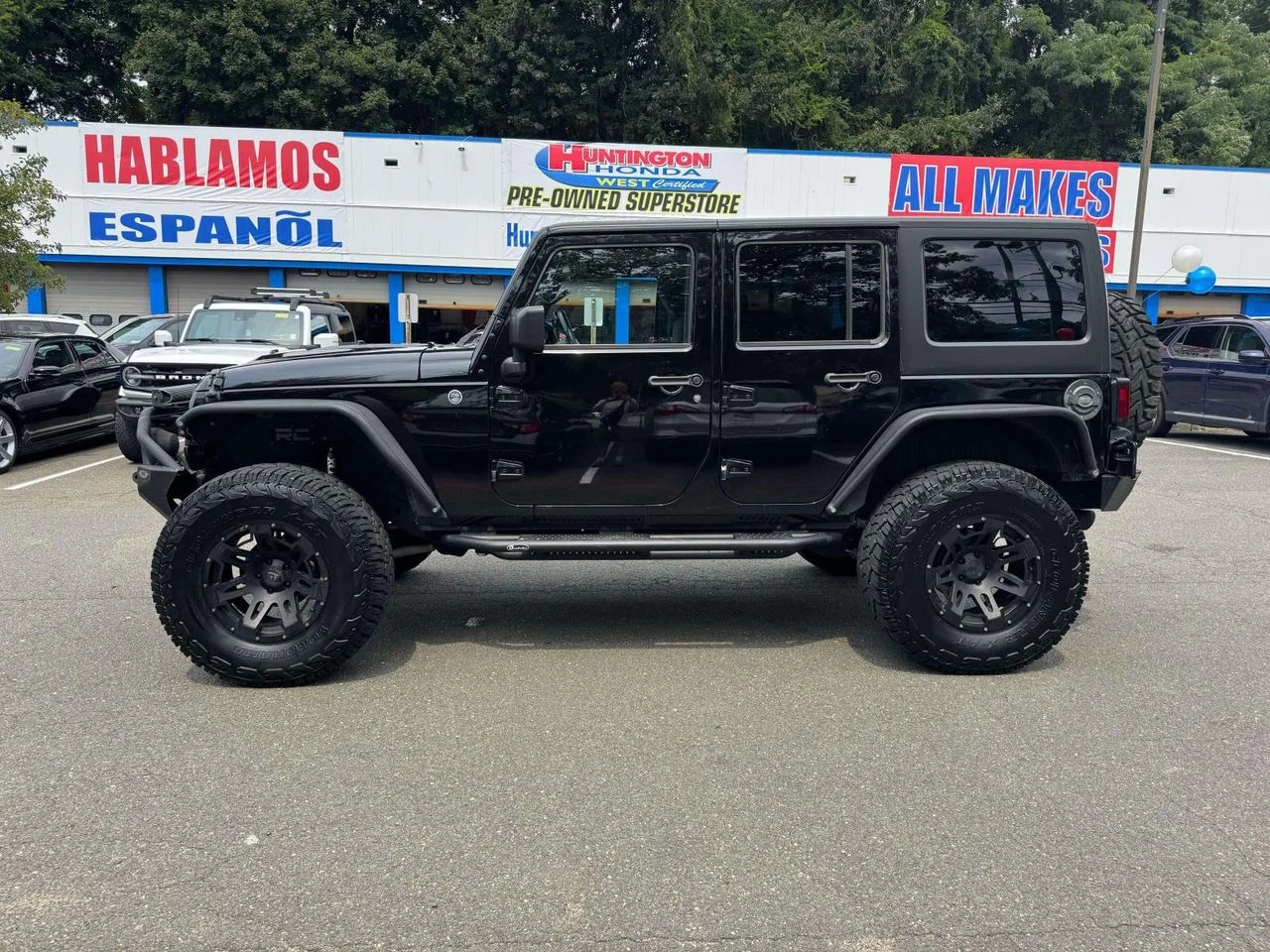 Used 2015 Black Clearcoat Jeep Sport image 5
