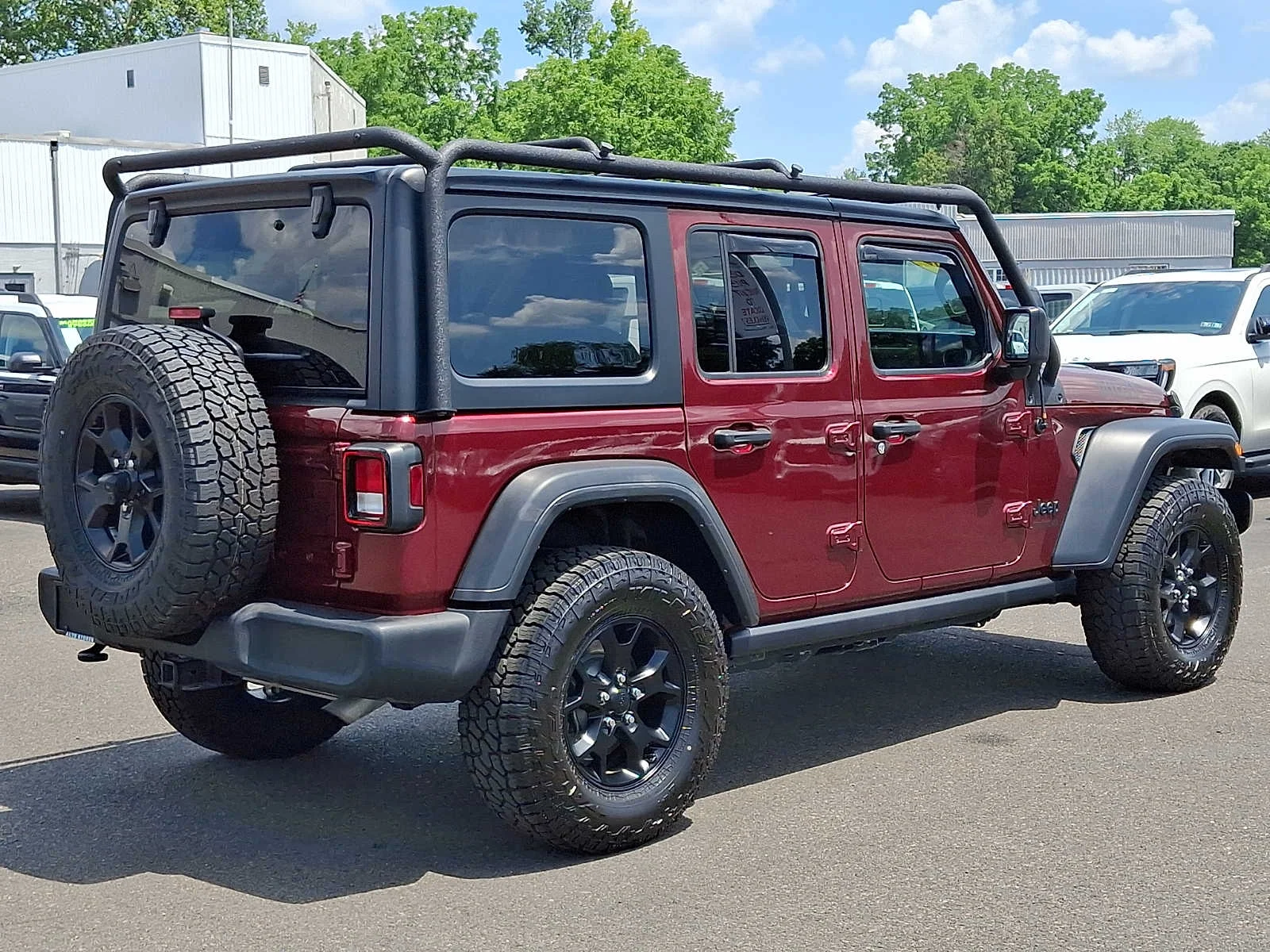 Used 2021 Snazzberry Pearlcoat Jeep Unlimited Willys image 6