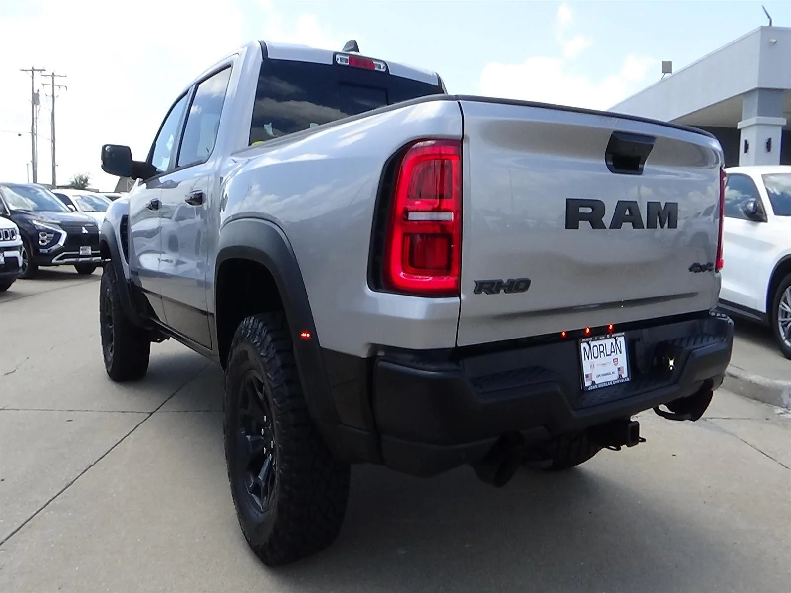 Used 2025 Billet Silver Metallic Clear Coat/Diamond Black Cr RAM RHO image 8