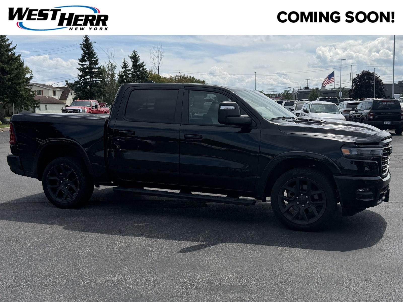 Used 2025 Diamond Black Crystal Pearlcoat Ram Laramie image 1