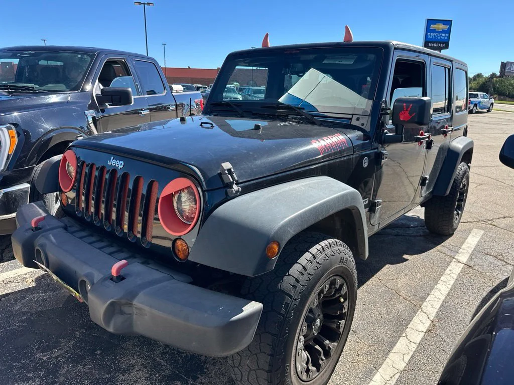 Used 2013 Black Jeep Unlimited Sport image 2