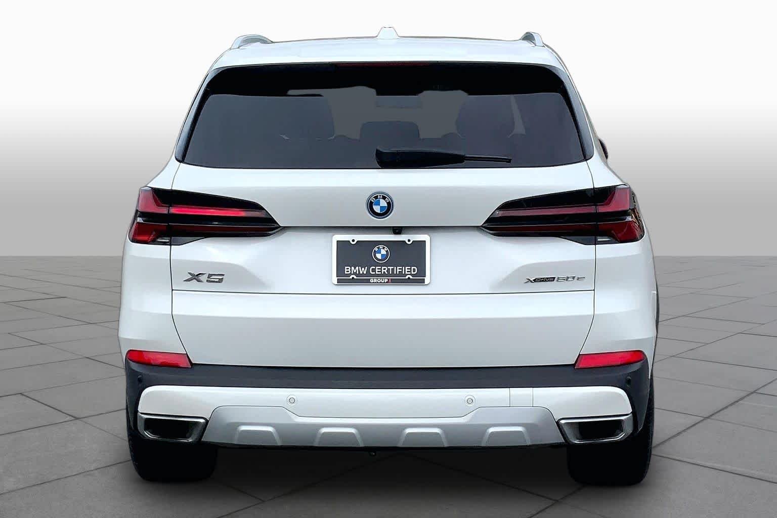 Used 2024 Mineral White Metallic BMW xDrive50e image 4