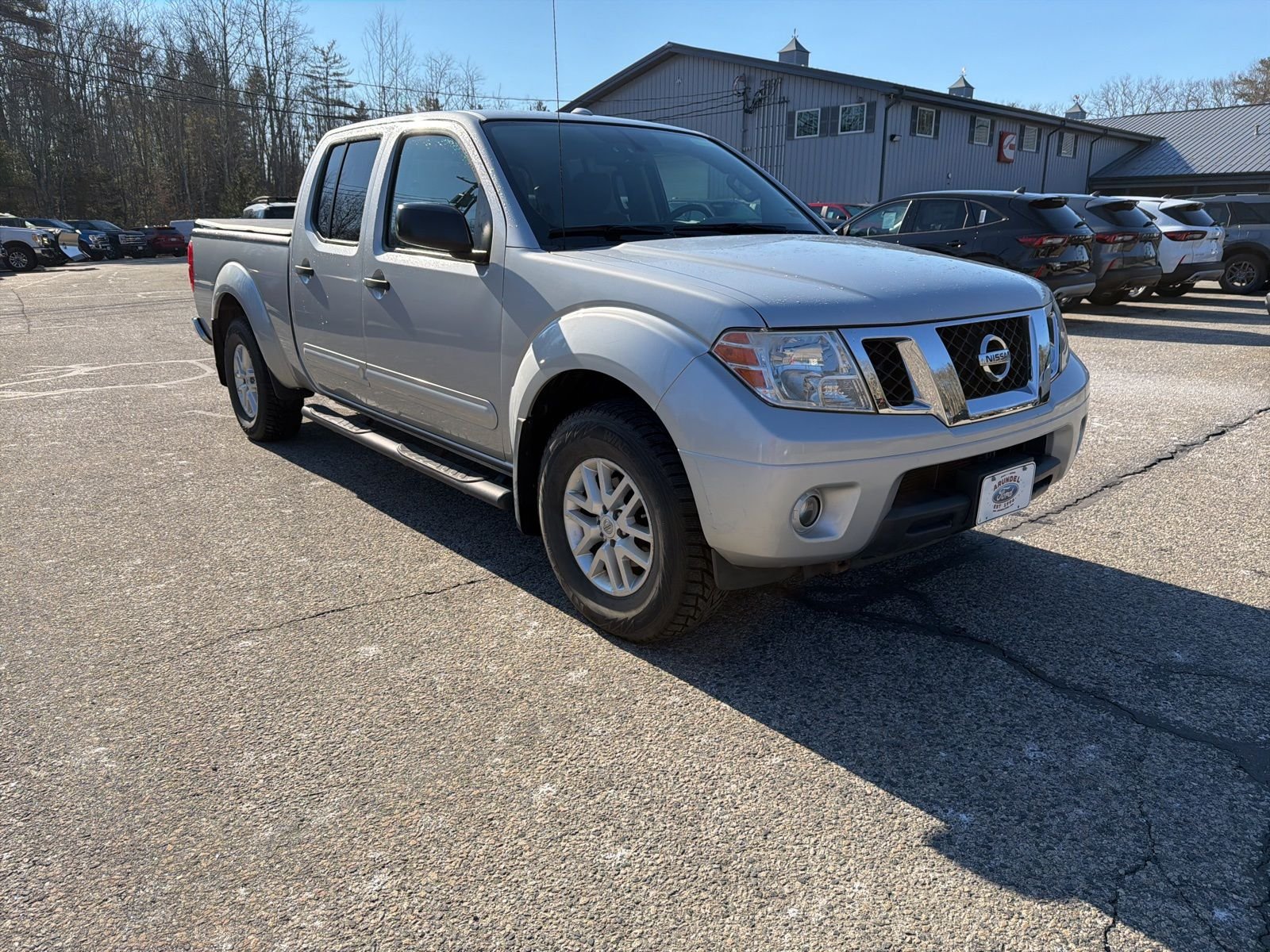 Brilliant Silver 2015 Nissan Frontier SV Crew Cab 4WD Pickup Truck Four-Wheel Drive
