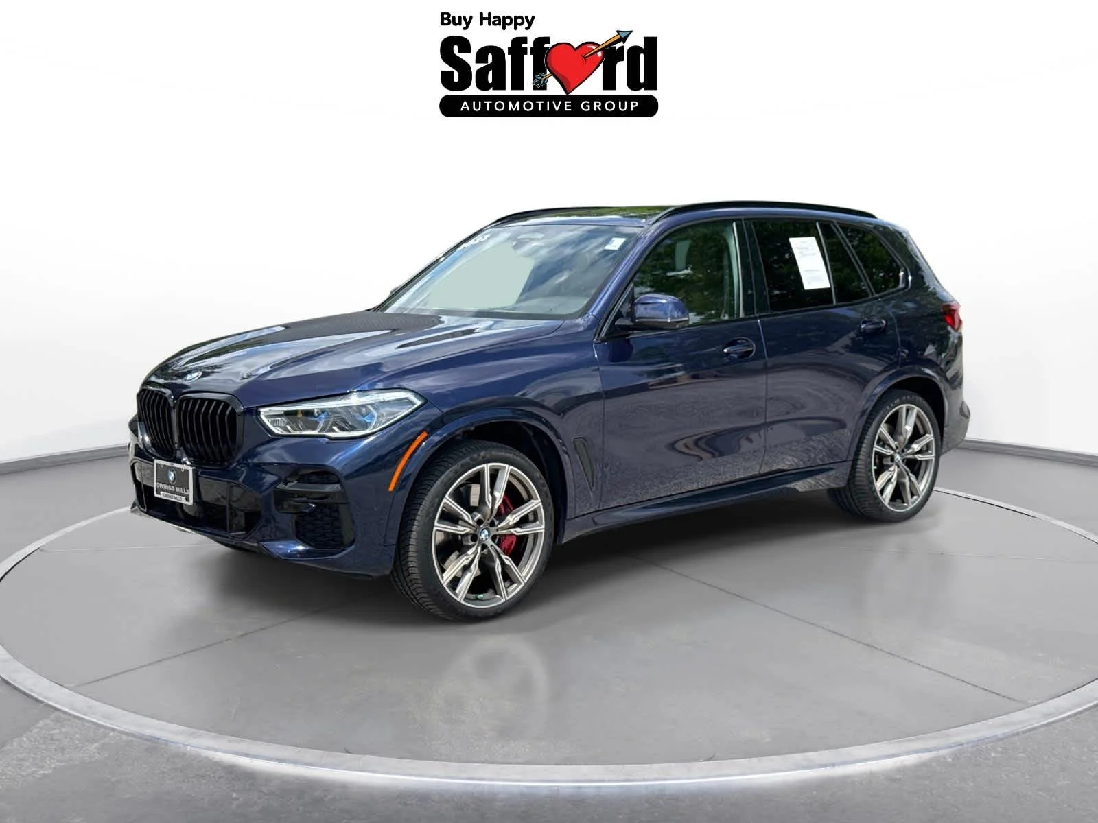 Used 2022 Tanzanite Blue II Metallic BMW M50i image 2