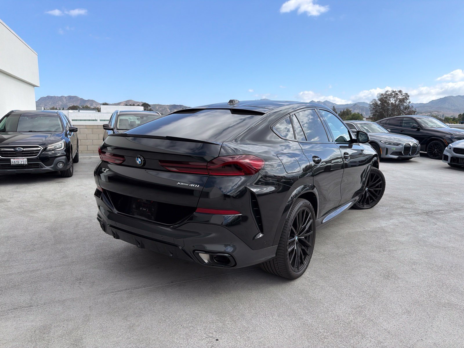 Certified Used 2024 Black Sapphire Metallic BMW xDrive40i image 4