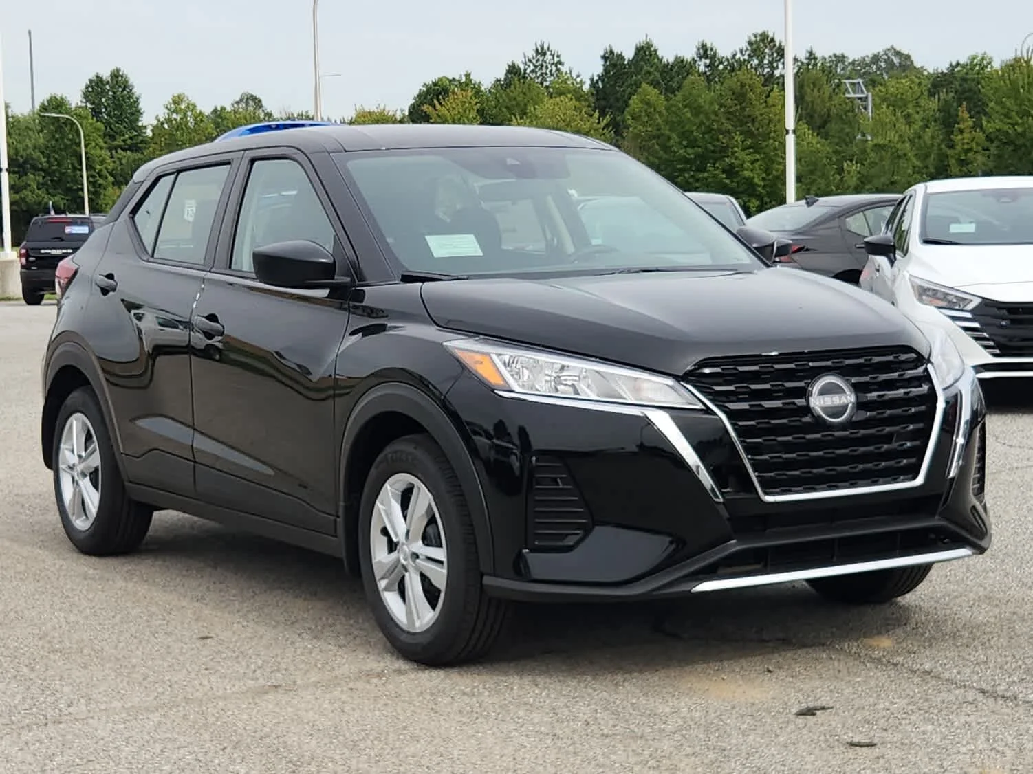 Certified Used 2025 Super Black Nissan S image 2