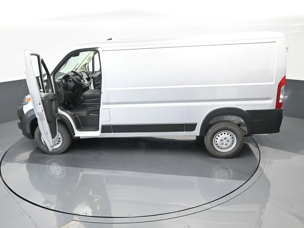 Used 2025 Bright Silver Clearcoat Metallic Ram Low Roof image 57